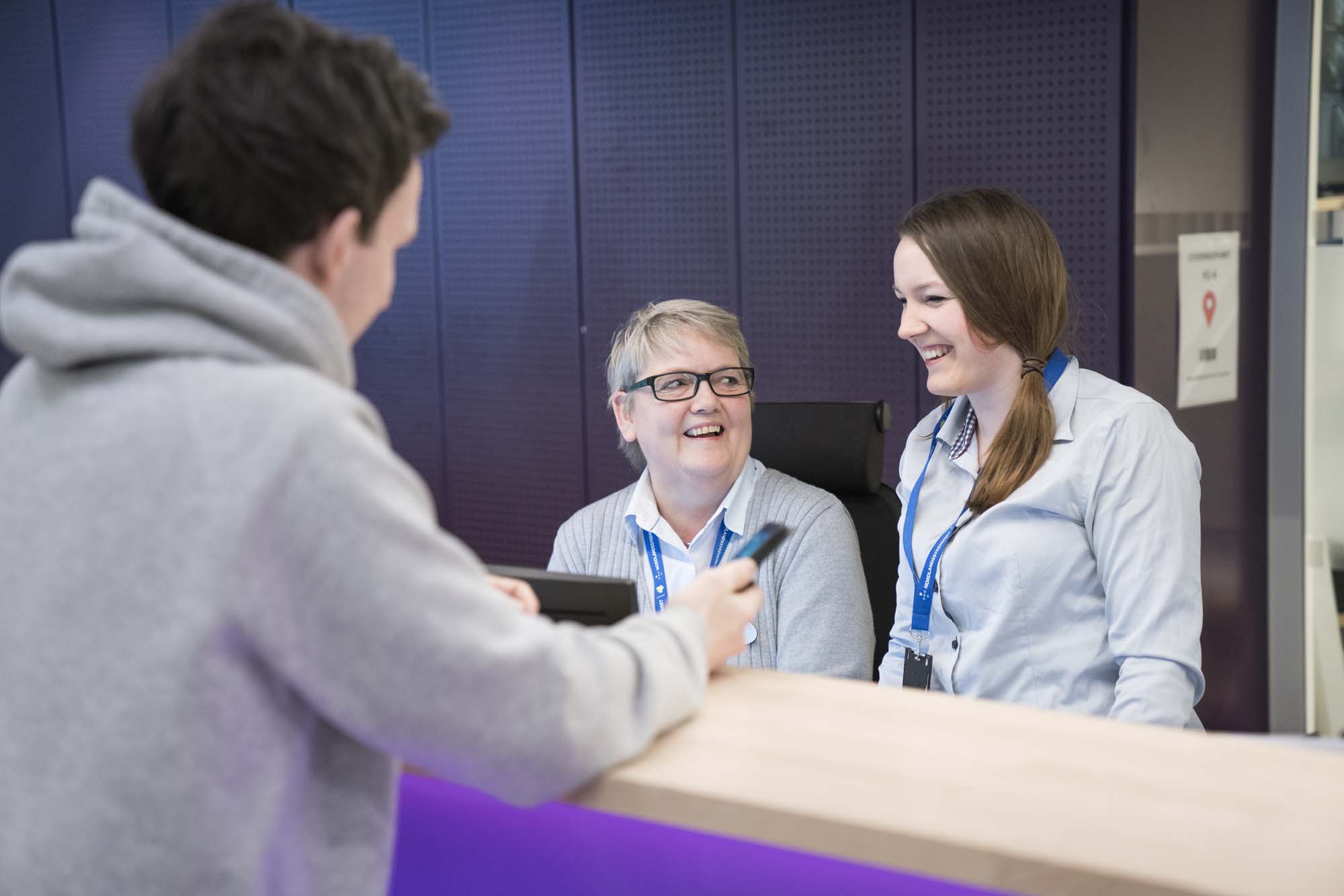 A woman talking to a man