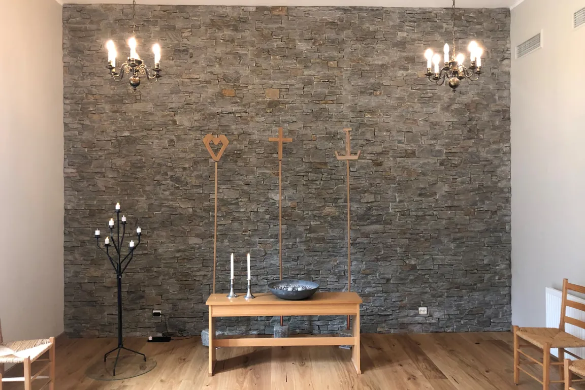 A room with a table and chairs