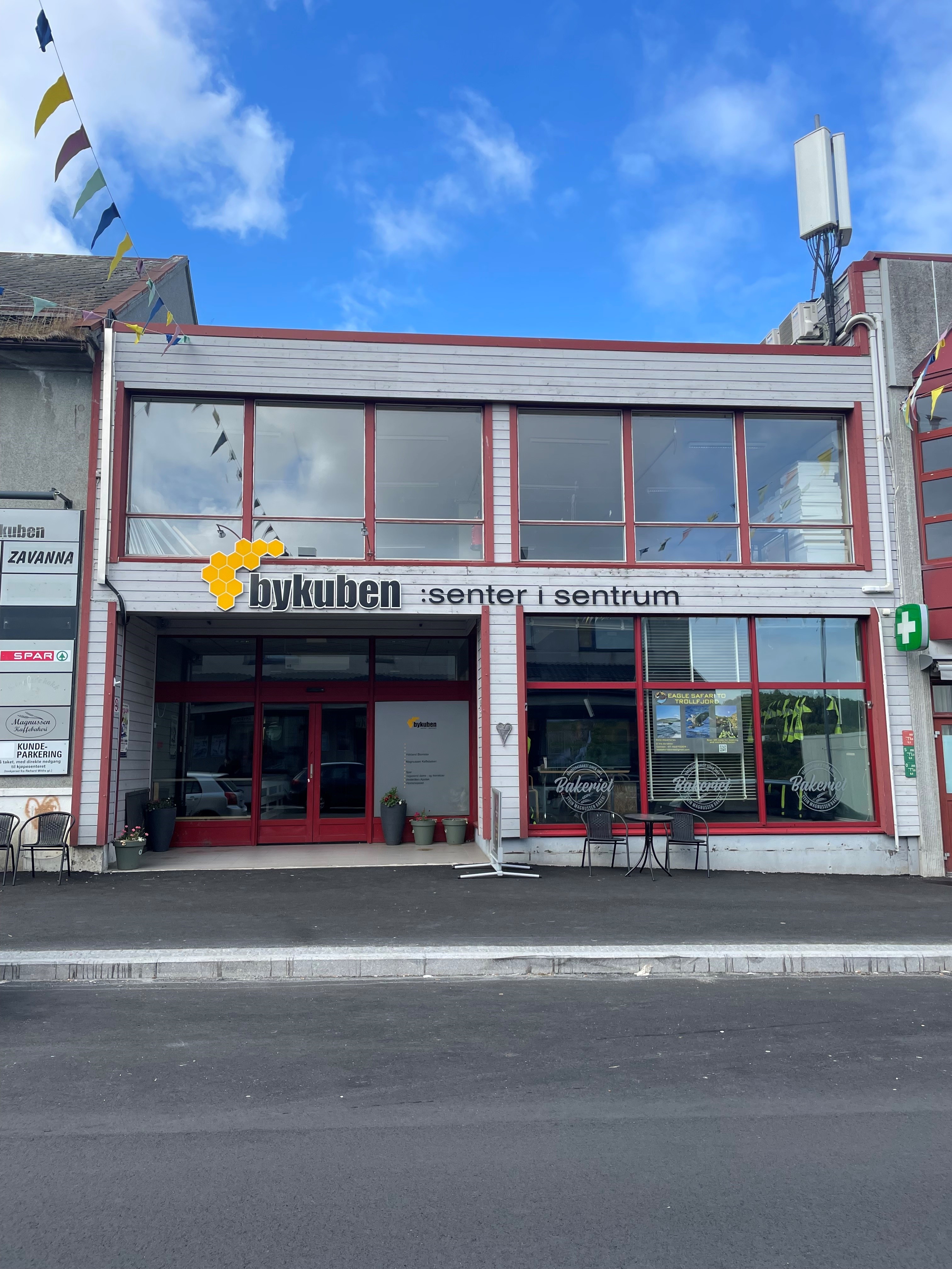 A red building with a sign on it